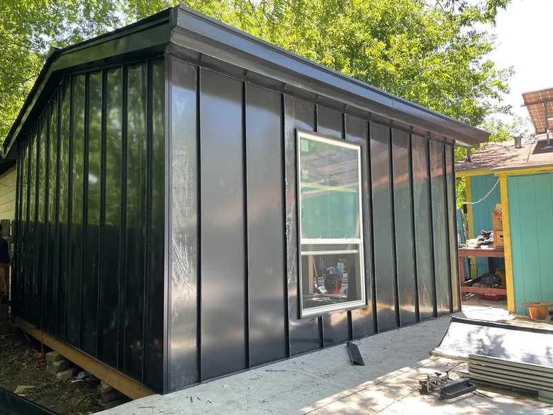 Black standing seam metal wall panels for Roof Inspection in Brownfield